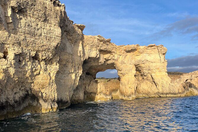 Blue Lagoon Ferry and Caves Tour - Passing the caves by boat: Window Cave and more