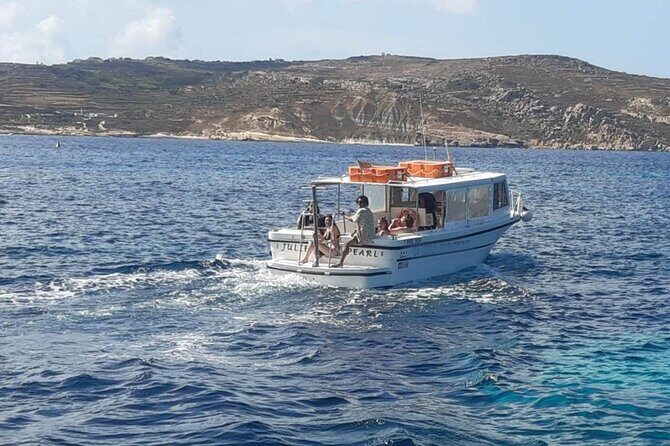 Comino and Gozo Private Boat Tour : Julie Pearl Boat - Comino’s Blue Lagoon stop: the anchor-and-swim part