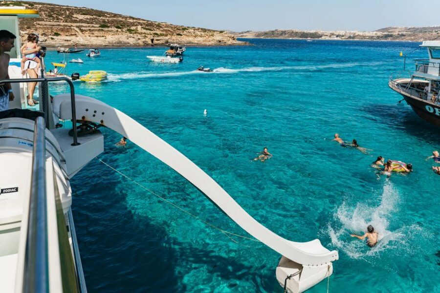Comino: Blue Lagoon, Crystal Lagoon, and Seacaves Tour - Blue Lagoon Mooring: Shallow Water, Clear Views, and Real Crowd Reality
