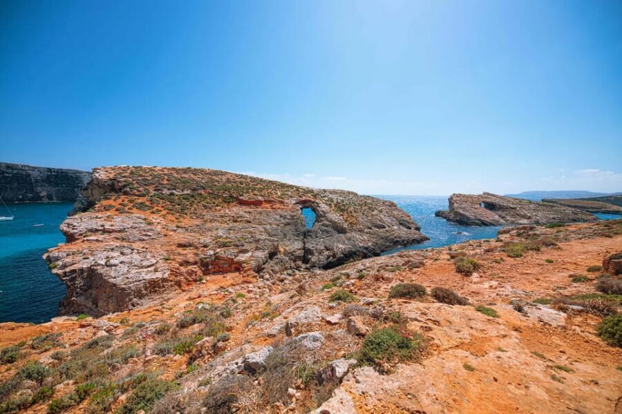 From Mellieha: Three Bay Cruise including the Blue Lagoon - Crystal Lagoon on Comino: caves, shelter, and 360-degree views