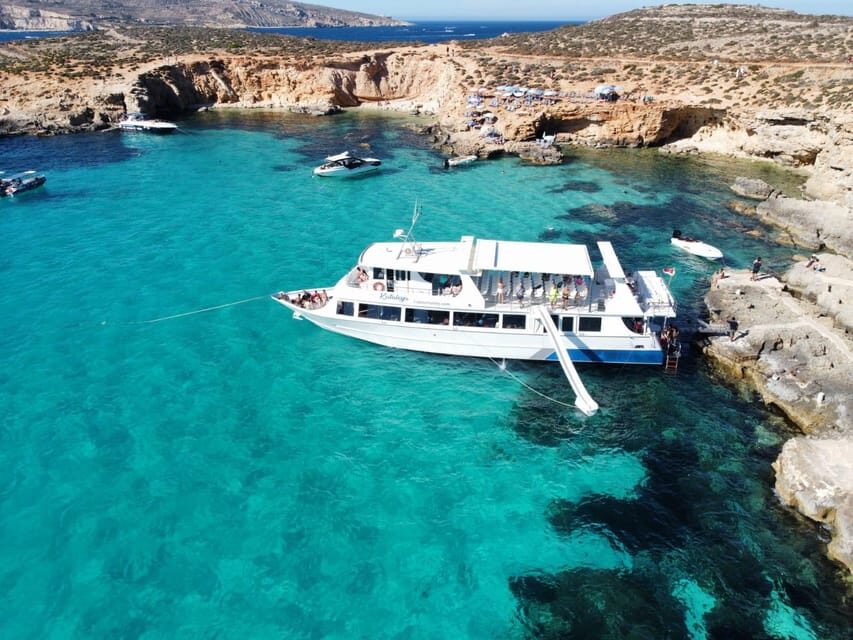 From Sliema: Gozo, Comino and Blue Lagoon Cruise - Comino caves: Santa Maria photo stop and crystal-cave sightseeing