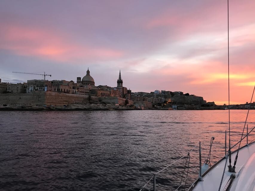 From Valletta: Romantic Sunset Cruise on a Sailing Yacht - The anchor stop: swimming plus dinner under the stars