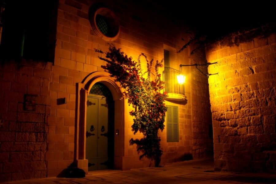 Mdina: Valletta Waterfront Area, Mdina, and Rabat Night Tour - Rabat at night: narrow streets, historic layers, and balcony silhouettes