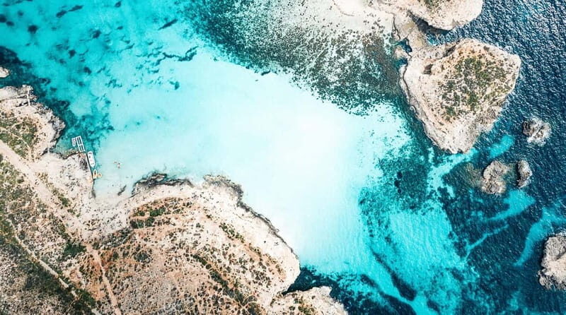 Mellieha: Round Comino, Blue Lagoon & Gozo Cruise with Water - Crystal Lagoon: a second swim break with cliff-backed views
