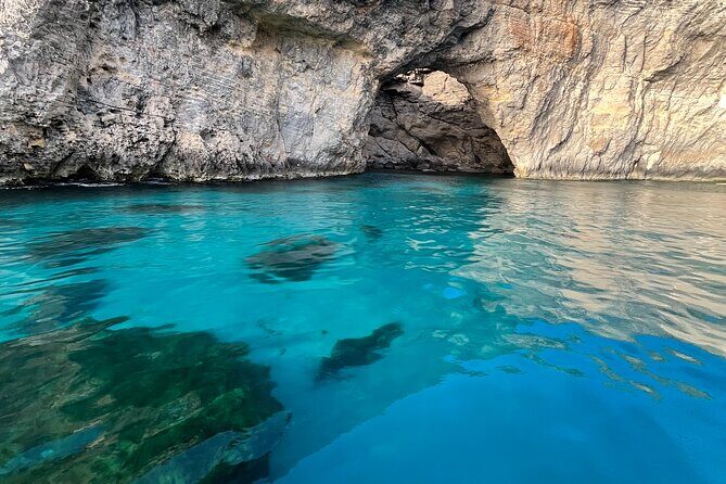 Private Boat Charter Blue Lagoon Crystal Lagoon and Comino - Hondoq Bay: a calmer fourth stop for beach and swimming time