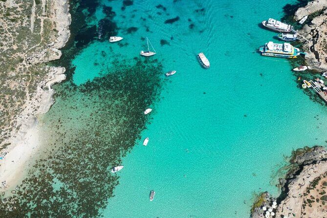 Private Boat Tour at Comino's Blue Lagoon and Crystal Lagoon - Comino’s dramatic cliffs: caves and a boat-only route