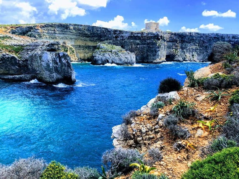 Sliema: Gozo/Comino Blue Lagoon Gulet Cruise w/ Lunch+Drinks - Gozo’s secluded bay swim stop: where the calm usually comes in