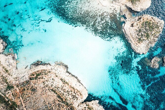 Three Bay Cruise Including Blue Lagoon from Mellieha - Crystal Lagoon on Comino: sheltered water and cave exploring time